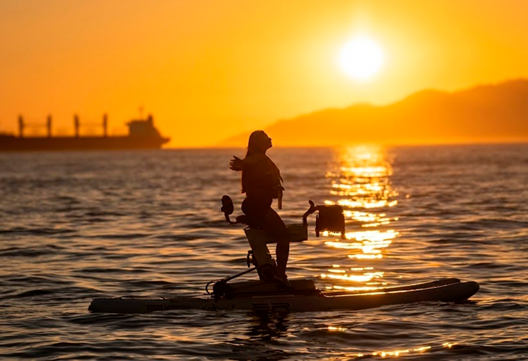 Sunset False Creek water bike ride with Vancouver skyline golden light